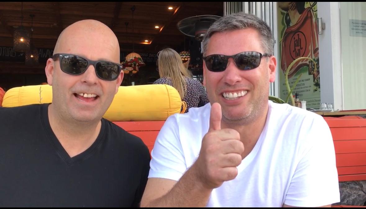 Two blokes at Jah Bar, thumbs up